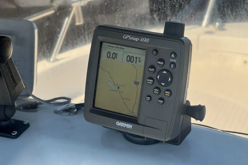 Slide: The Image of Garmin GPSmap 498 on 2006 Seaswirl Striper 1851 Center Console boat dashboard. - 26