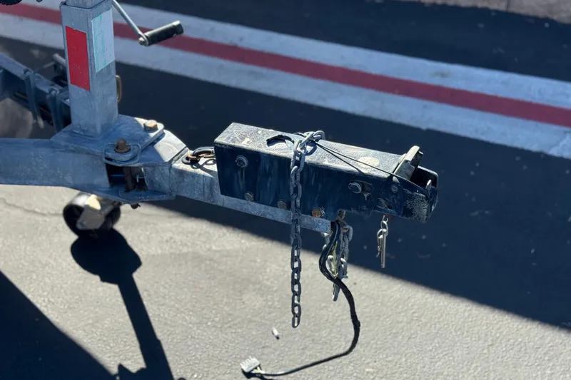 Slide: The Image of Trailer hitch of a 2006 Seaswirl Striper 1851 Center Console O/B on pavement. - 29