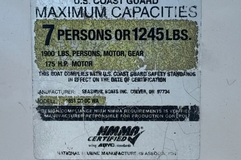 Slide: The Image of 2006 Seaswirl Striper 1851 Center Console capacity label, 7 persons or 1245 lbs, 175 HP motor. - 30