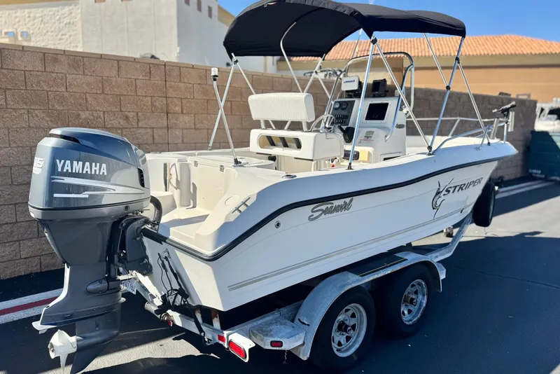 Slide: The Image of 2006 Seaswirl Striper 1851 Center Console boat with Yamaha outboard motor on trailer. - 5