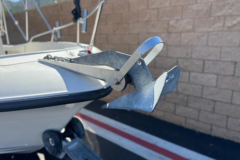 Slide: The Image of Anchor on 2006 Seaswirl Striper 1851 Center Console boat, parked near brick wall. - 8