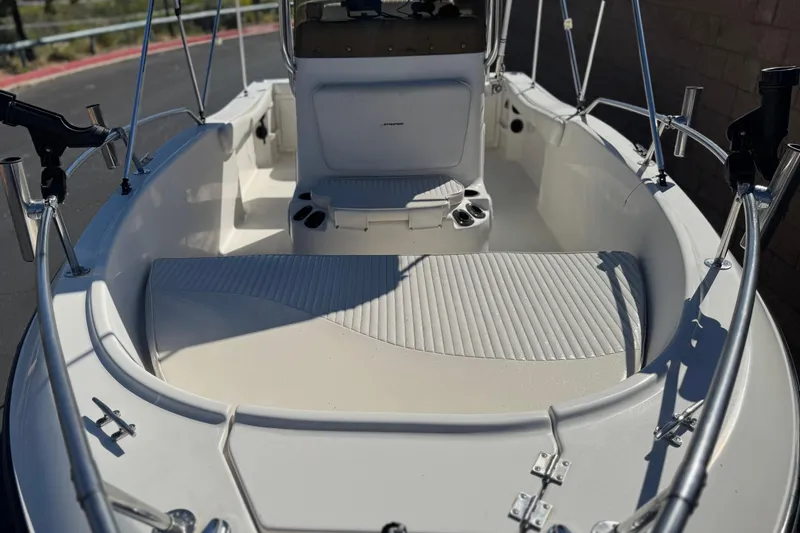 Slide: The Image of 2006 Seaswirl Striper 1851 Center Console O/B boat interior with seating and rod holders. - 9