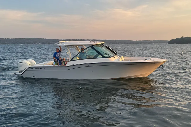 The Image of Grady-White Freedom 325 boat on calm water at sunset, year 2026. - 0