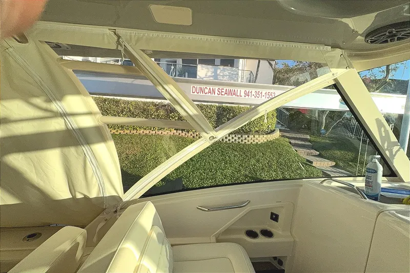 Slide: The Image of Interior view of 2026 Grady-White Freedom 325 boat with seating and window. - 11