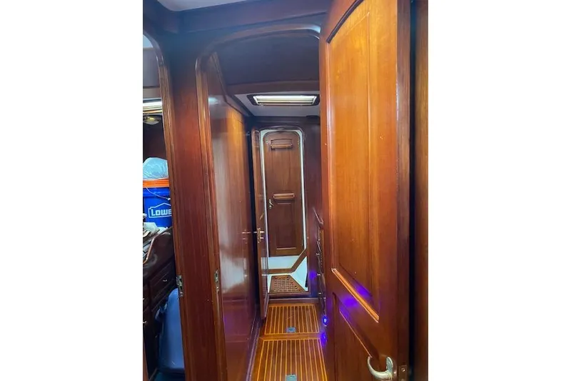 Slide: The Image of Interior view of 1990 Little Harbor Sloop 58' with wooden doors and flooring. - 13