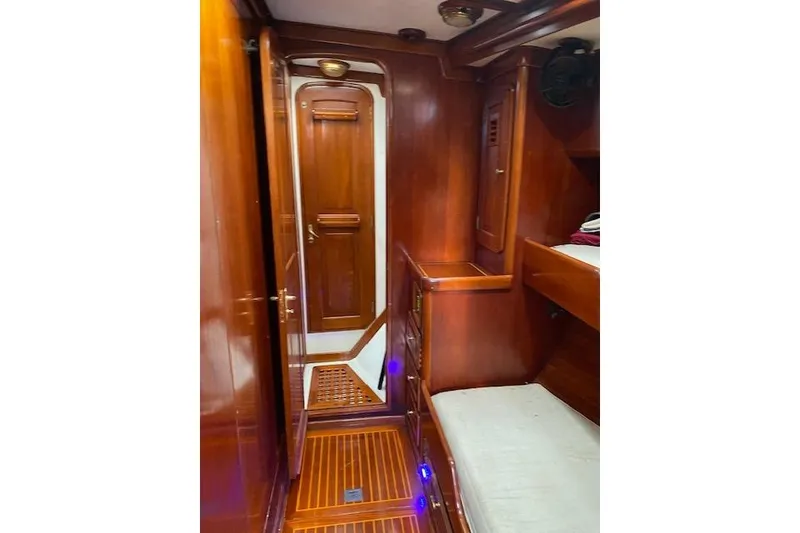Slide: The Image of Luxurious wooden interior of a 1990 Little Harbor Sloop 58' yacht cabin. - 16