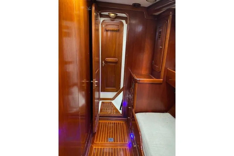Slide: The Image of Luxurious wooden interior of 1990 Little Harbor Sloop 58' yacht cabin hallway. - 17