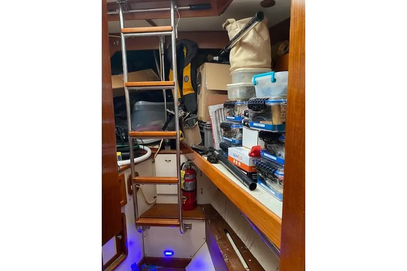 Slide: The Image of Interior of 1990 Little Harbor Sloop 58' with storage and ladder. - 20