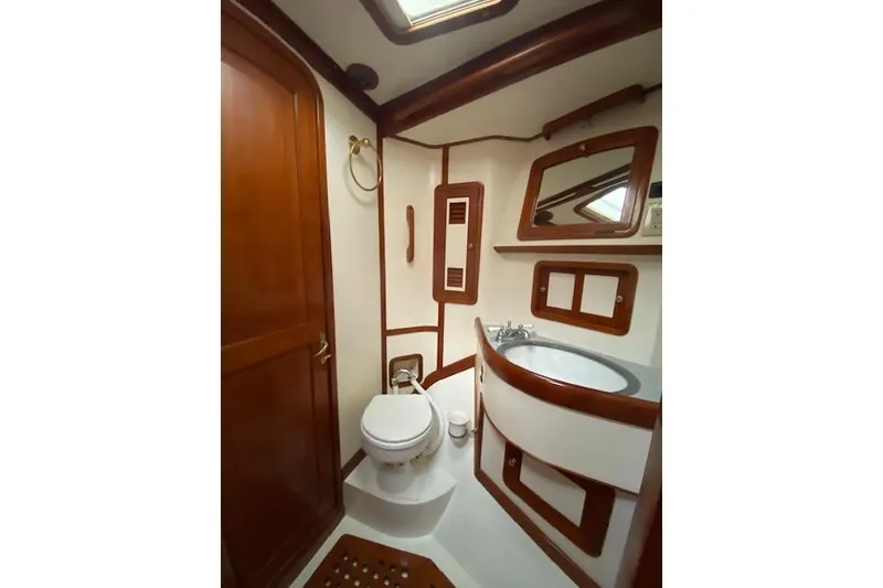 Slide: The Image of Elegant 1990 Little Harbor Sloop 58' yacht bathroom with wood accents and modern fixtures. - 21
