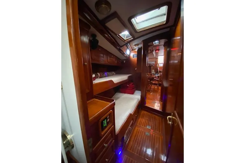 Slide: The Image of Interior of 1990 Little Harbor Sloop 58' with wooden bunk beds and polished finish. - 22