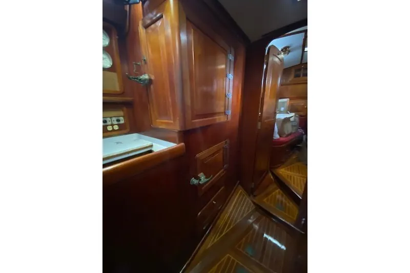Slide: The Image of Interior of 1990 Little Harbor Sloop 58' with polished wood cabinetry and flooring. - 33