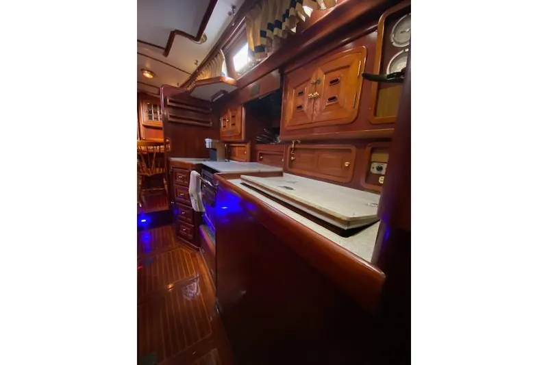 Slide: The Image of Luxurious wooden interior of a 1990 Little Harbor Sloop 58' yacht kitchen. - 34