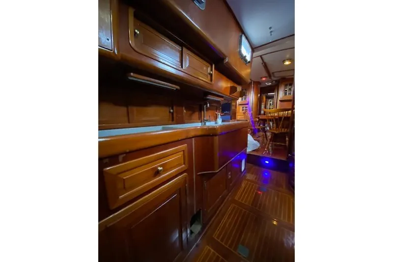 Slide: The Image of Interior of a 1990 Little Harbor Sloop 58' yacht with wooden cabinetry and flooring. - 35