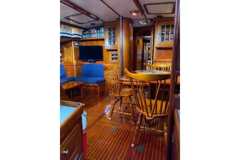 Slide: The Image of Luxurious 1990 Little Harbor Sloop interior with wooden furnishings and cozy seating area. - 39