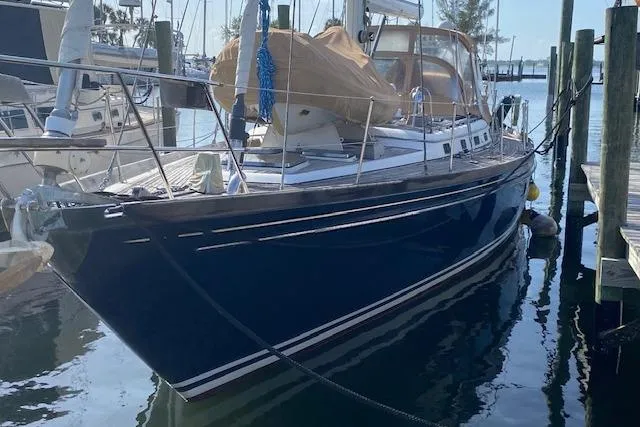 Slide: The Image of 1990 Little Harbor Sloop 58' docked in a marina, featuring sleek design and classic lines. - 4