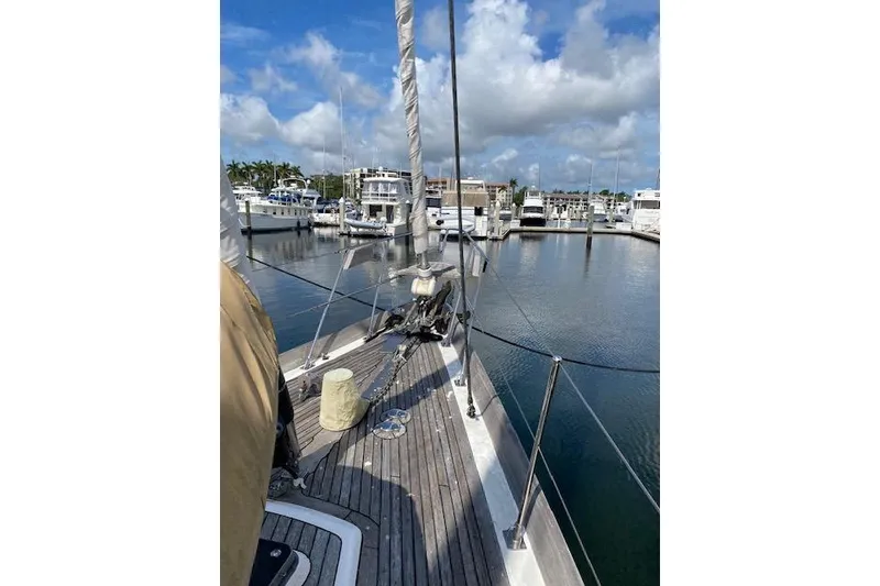 Slide: The Image of Sailing yacht Little Harbor Sloop 58' (1990) docked at marina under blue sky. - 46