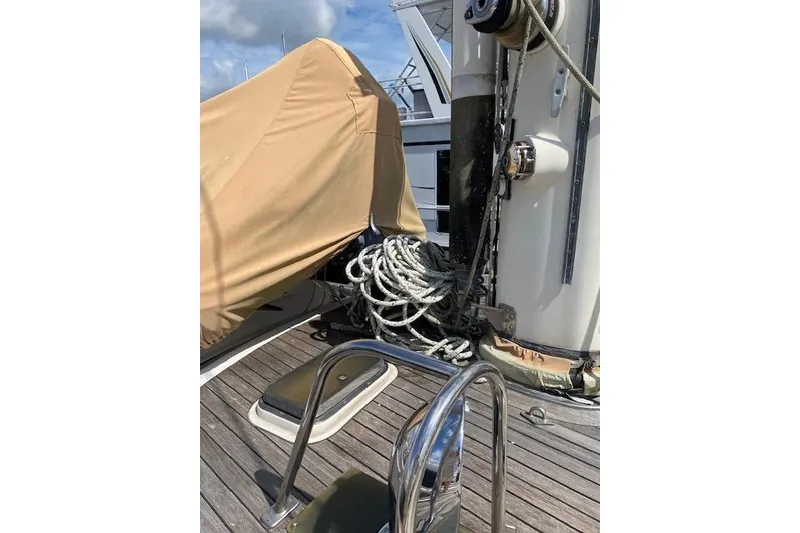 Slide: The Image of Deck of 1990 Little Harbor Sloop 58' with ropes and covered equipment. - 53
