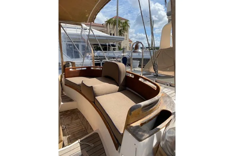 Slide: The Image of Luxurious seating area on a 1990 Little Harbor Sloop 58' yacht, docked under sunny skies. - 59