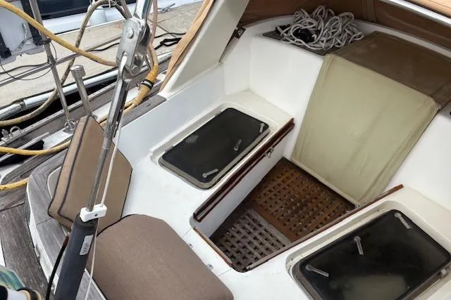 Slide: The Image of Cockpit of 1990 Little Harbor Sloop 58' with seating and storage compartments. - 69