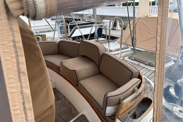 Slide: The Image of 1990 Little Harbor Sloop 58' with cushioned seating in the cockpit area. - 73