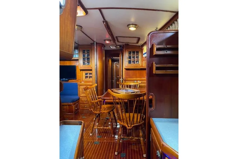 Slide: The Image of Luxurious 1990 Little Harbor Sloop 58' interior with elegant wood finish and cozy seating. - 9