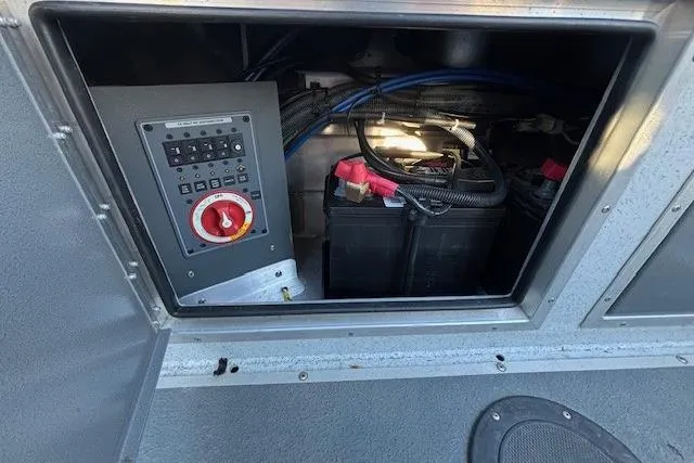 Slide: The Image of Electrical panel and battery compartment of 2023 North River 23' Seahawk boat. - 15