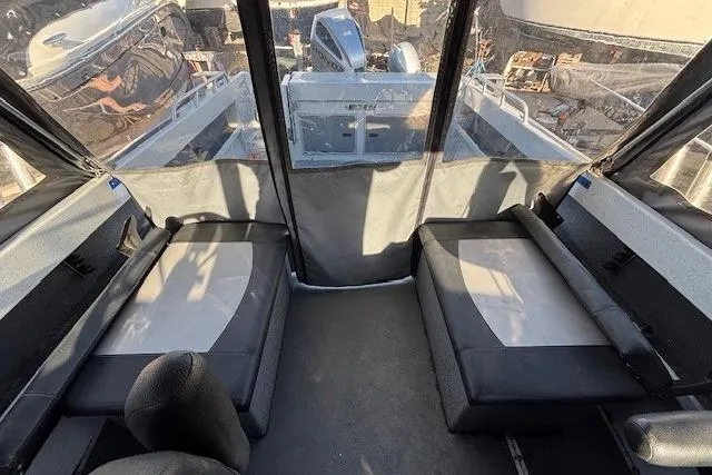 Slide: The Image of 2023 North River 23' Seahawk interior with seating and view of the outboard motor. - 18