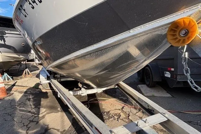 Slide: The Image of 2023 North River 23' Seahawk boat on trailer, close-up view of hull and bow. - 2