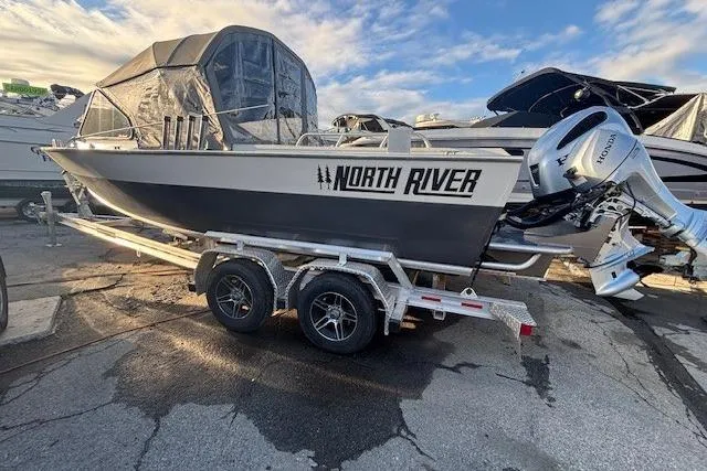 Slide: The Image of 2023 North River 23' Seahawk boat on trailer with Honda outboard motor. - 4