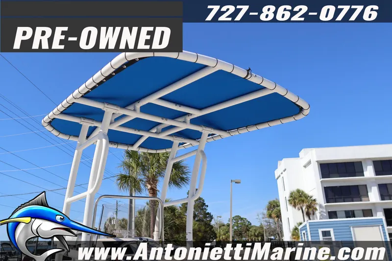 Slide: The Image of Pre-owned 2016 Carolina Skiff 178 DLV boat with blue canopy, available at Antonietti Marine. - 10