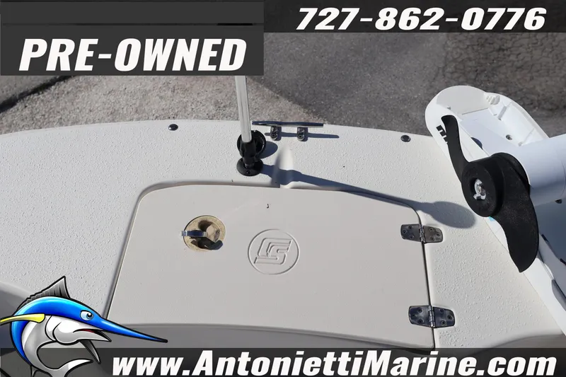 Slide: The Image of Pre-owned 2016 Carolina Skiff 178 DLV boat deck with contact details and logo. - 13