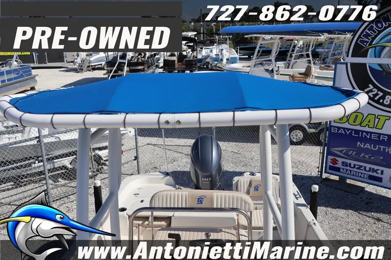 Slide: The Image of Pre-owned 2016 Carolina Skiff 178 DLV boat with blue canopy at Antonietti Marine. - 16