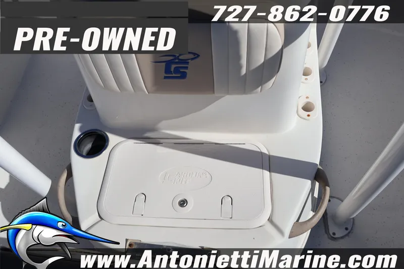 Slide: The Image of Pre-owned 2016 Carolina Skiff 178 DLV boat interior with storage compartment. - 17