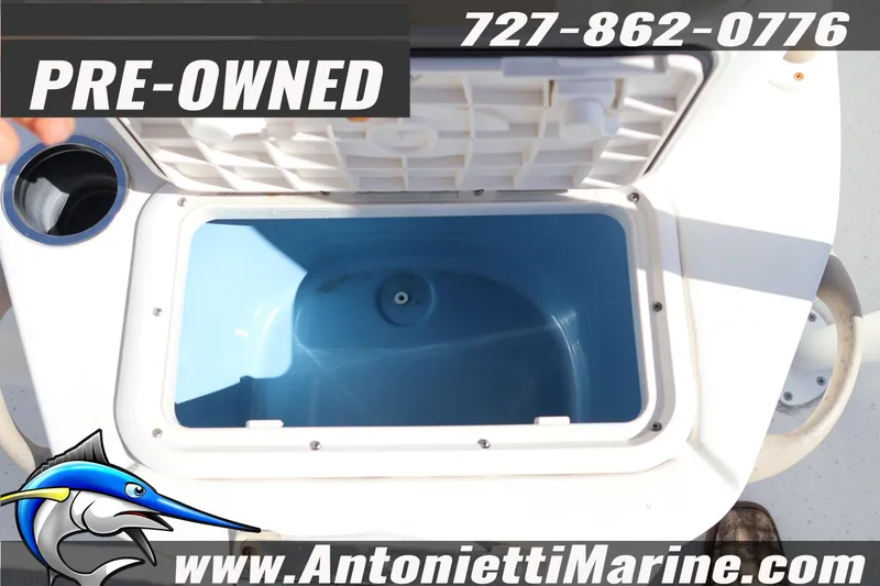 Slide: The Image of Pre-owned 2016 Carolina Skiff 178 DLV boat with open storage compartment. - 18
