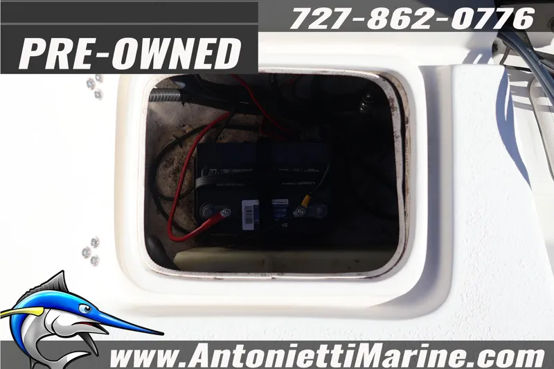 Slide: The Image of Pre-owned 2016 Carolina Skiff 178 DLV boat battery compartment view. - 29
