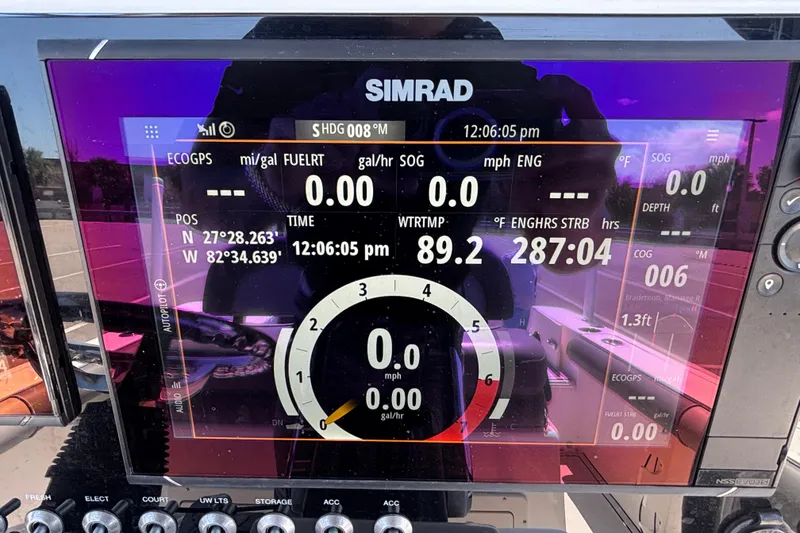 Slide: The Image of Simrad display on 2023 Sea Born LX24 Center Console showing navigation and engine data. - 10