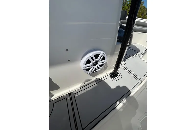 Slide: The Image of 2023 Sea Born LX24 Center Console boat interior with speaker and deck details. - 15