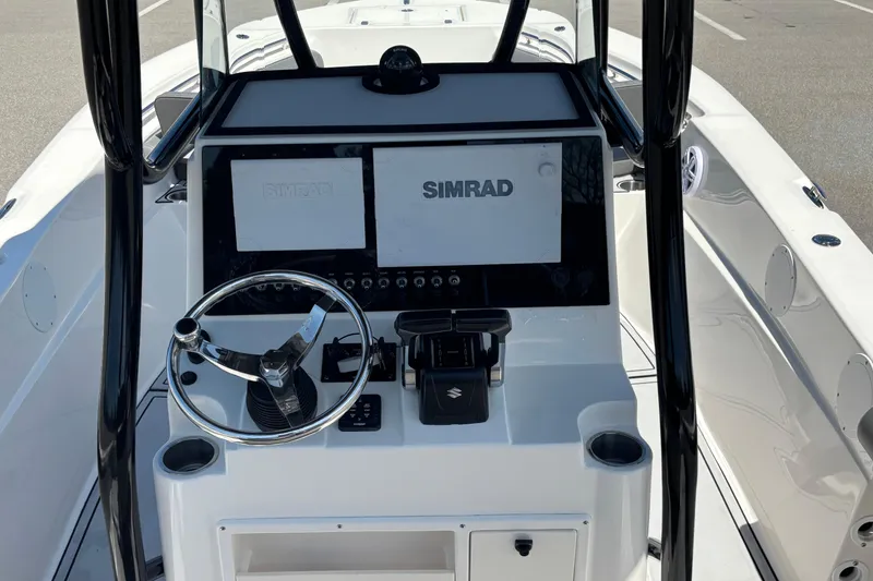 Slide: The Image of 2023 Sea Born LX24 Center Console boat dashboard with Simrad navigation system. - 21