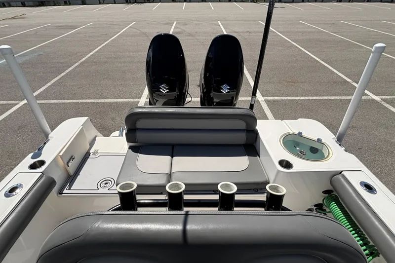 Slide: The Image of 2023 Sea Born LX24 Center Console boat interior with seating and fishing rod holders. - 22