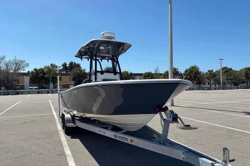 Slide: The Image of 2023 Sea Born LX24 Center Console boat on trailer in parking lot. - 4