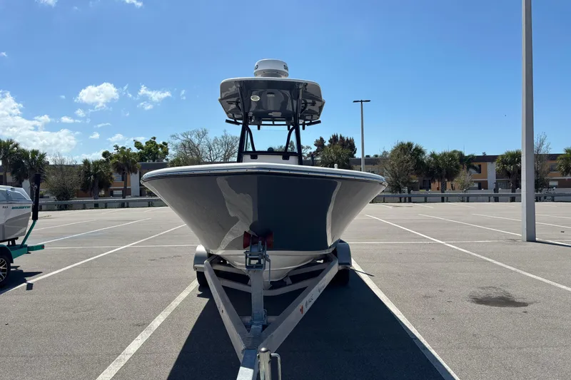 Slide: The Image of 2023 Sea Born LX24 Center Console boat on trailer in sunny parking lot. - 5
