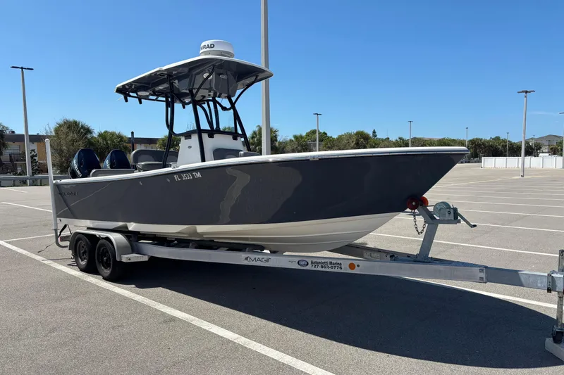 Slide: The Image of 2023 Sea Born LX24 Center Console boat on trailer in parking lot. - 7