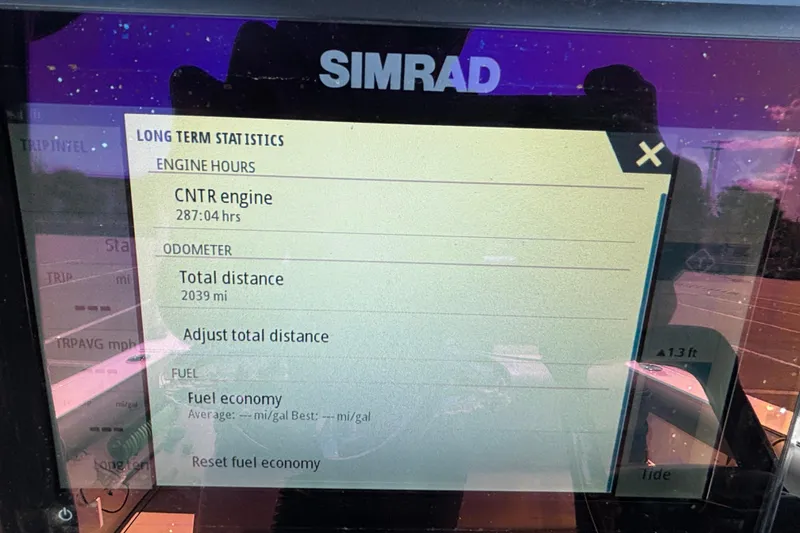 Slide: The Image of Simrad display showing engine hours and odometer for 2023 Sea Born LX24 Center Console. - 9