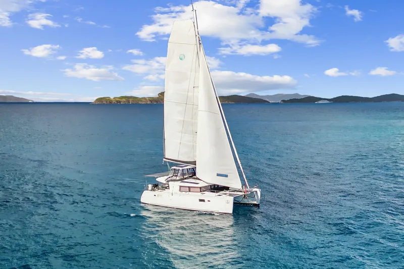 The Image of Sailing Lagoon 450 F catamaran, 2017 model, gliding on clear blue ocean under a sunny sky. - 0
