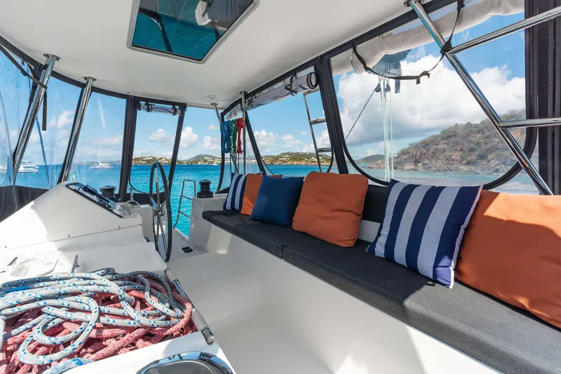 Slide: The Image of Interior of 2017 Lagoon 450 F catamaran with colorful cushions and ocean view. - 17