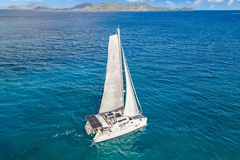 Slide: The Image of 2017 Lagoon 450 F catamaran sailing on clear blue ocean waters. - 2
