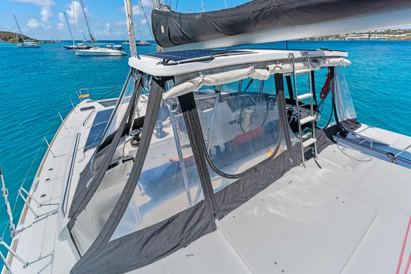 Slide: The Image of Lagoon 450 F catamaran, 2017 model, anchored in clear blue waters with visible cockpit. - 22