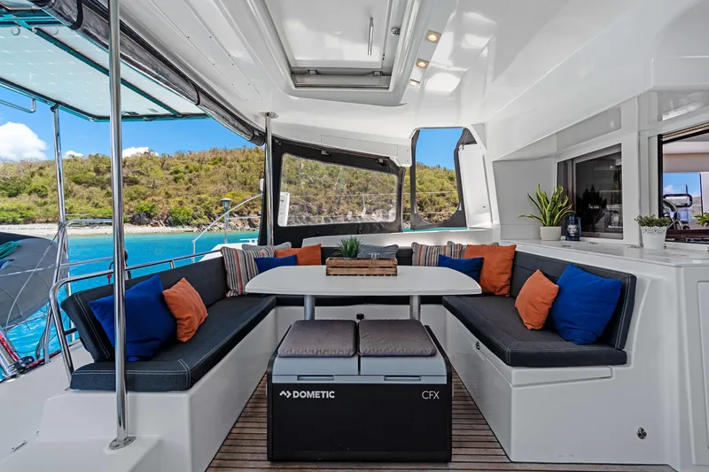 Slide: The Image of Luxurious 2017 Lagoon 450 F yacht interior with cozy seating and scenic ocean view. - 45
