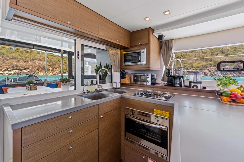 Slide: The Image of Modern kitchen interior on 2017 Lagoon 450 F yacht with appliances and scenic window view. - 49