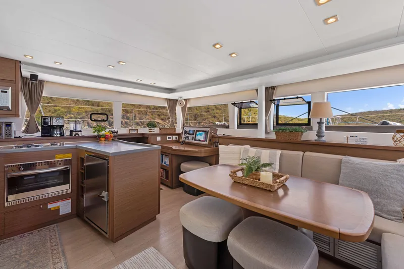Slide: The Image of Interior of 2017 Lagoon 450 F catamaran with modern kitchen and dining area. - 51